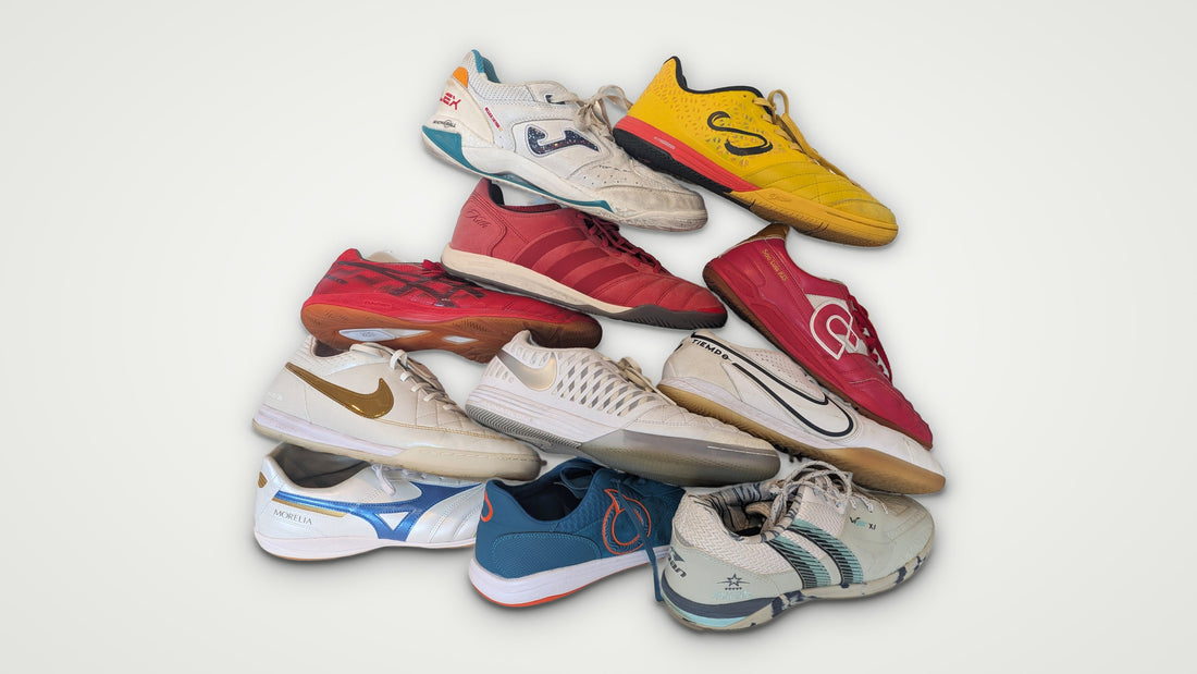A stack of 11 futsal and indoor shoes from brands including Joma, Senda, Nike, adidas, Mizuno, Asics, Desporte and Pan
